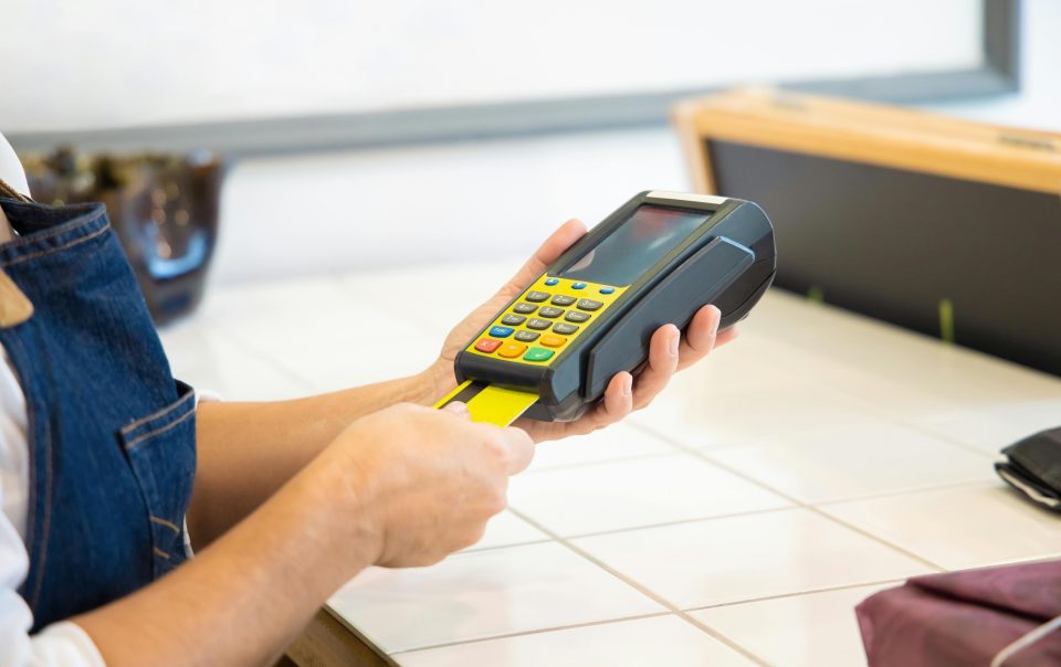https://www.pexels.com/photo/a-person-holding-a-pos-machine-6023605/