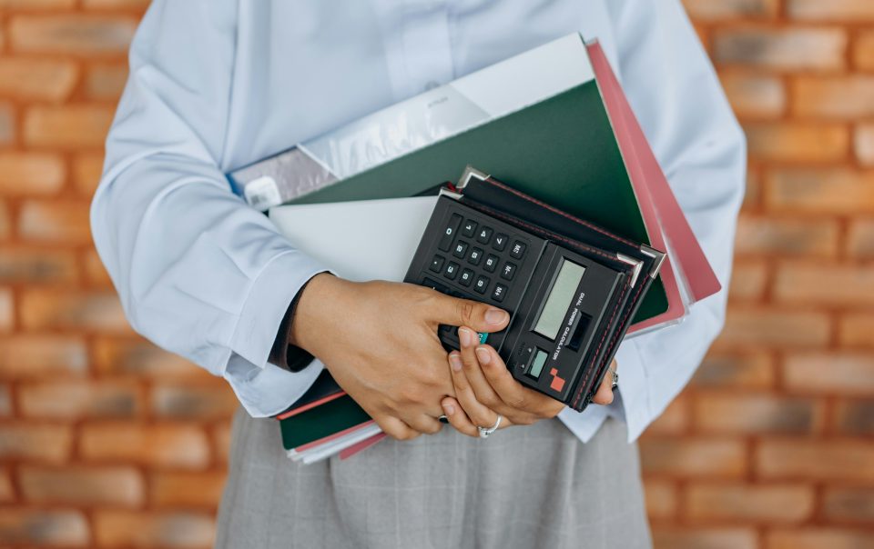 A Person Holding Black Calculator