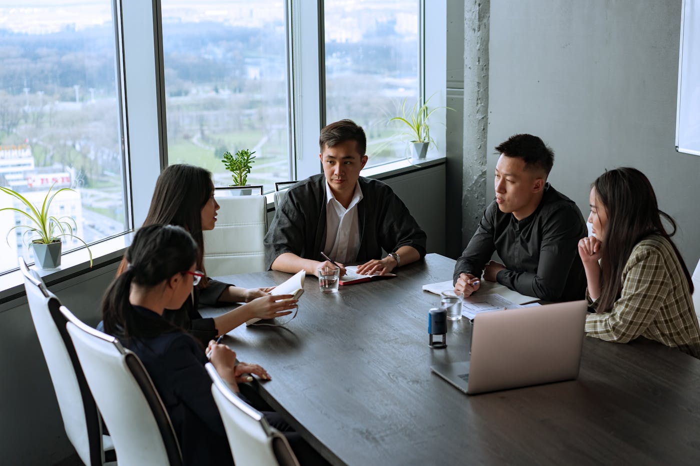 Rockbell team in a boardroom strategy meeting